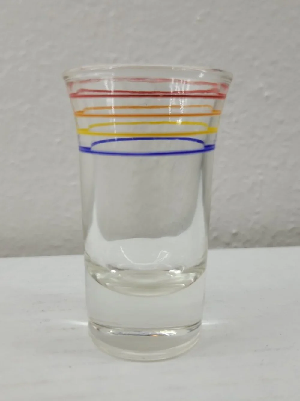 Vintage shot glass clear with orange red yellow blue stripes Mid-century Modern